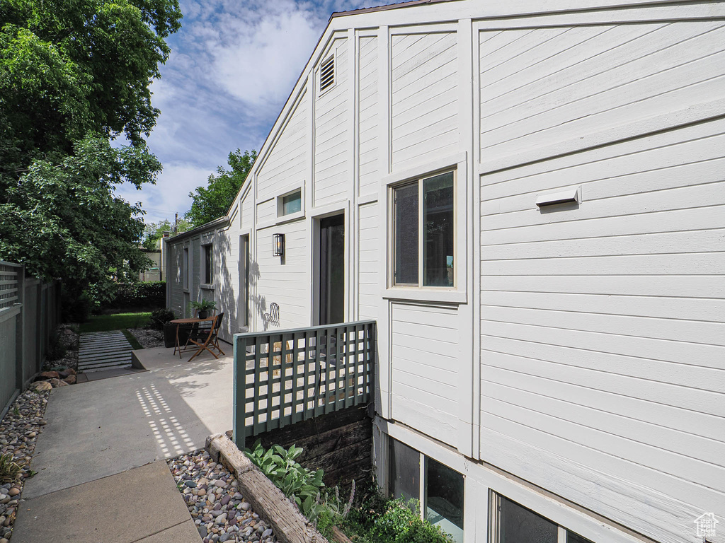 View of side of home featuring a patio
