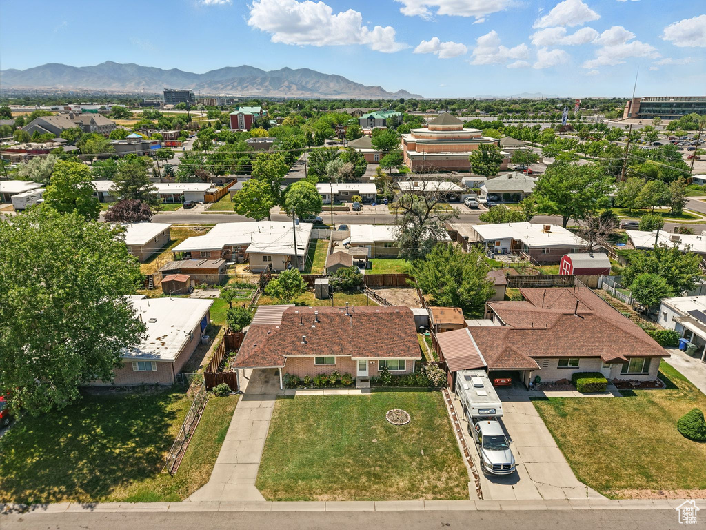 Aerial perspective of suburban area with a mountain backdrop