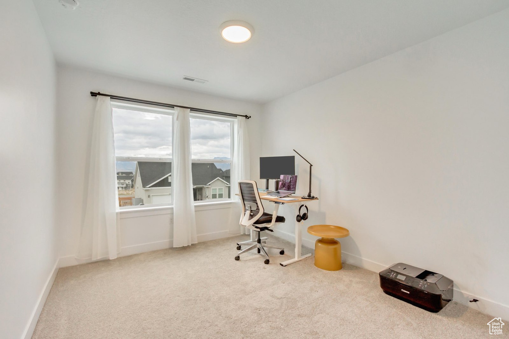 Home office featuring carpet floors