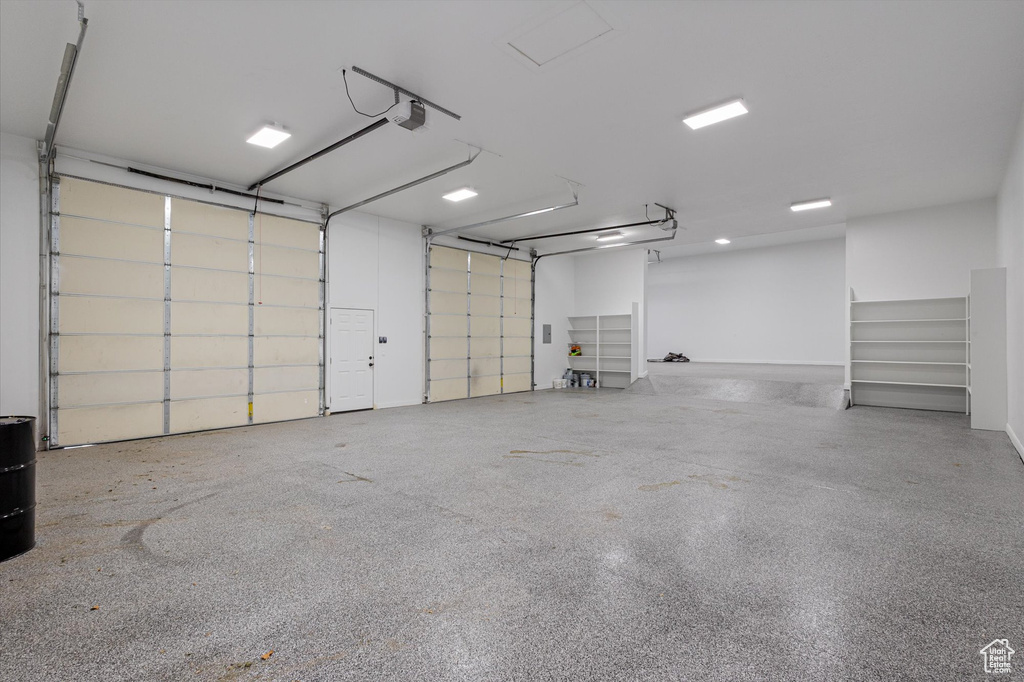 Garage featuring a garage door opener