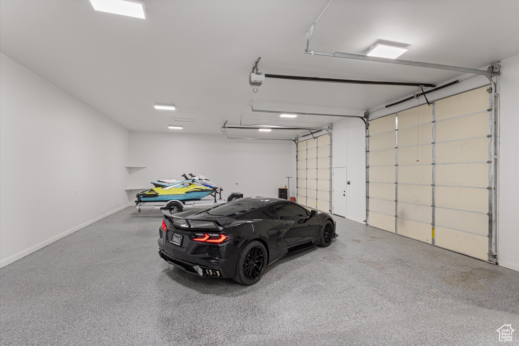 Garage featuring a garage door opener