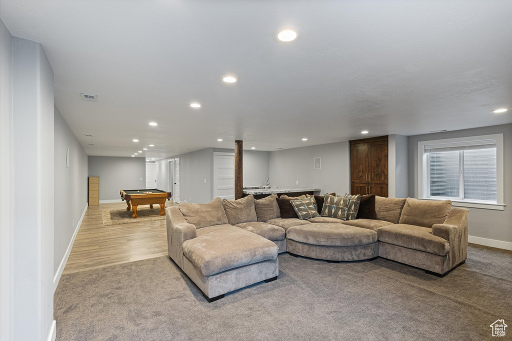 Carpeted living room featuring pool table and recessed lighting