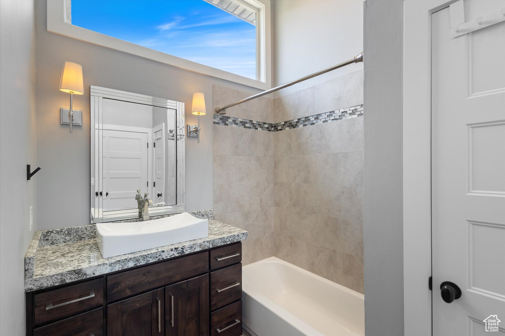Full bath featuring vanity and tub / shower combination