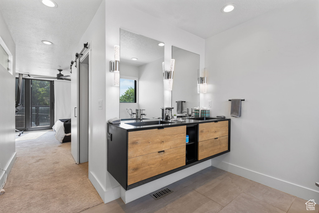 Bathroom featuring double vanity and recessed lighting