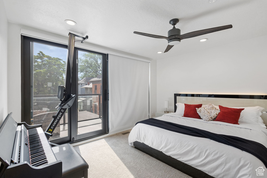 Bedroom with access to exterior, recessed lighting, and a ceiling fan