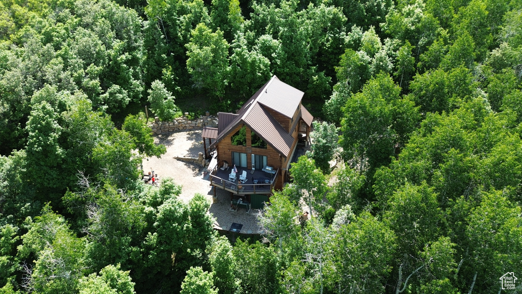 View of subject property with a forest