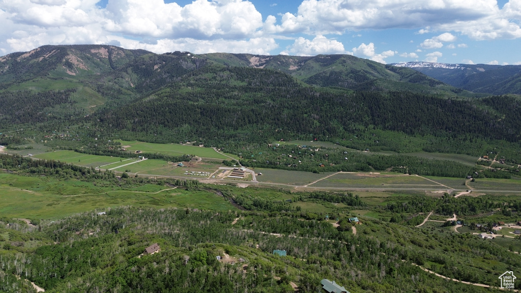 View of mountain background featuring rural landscape