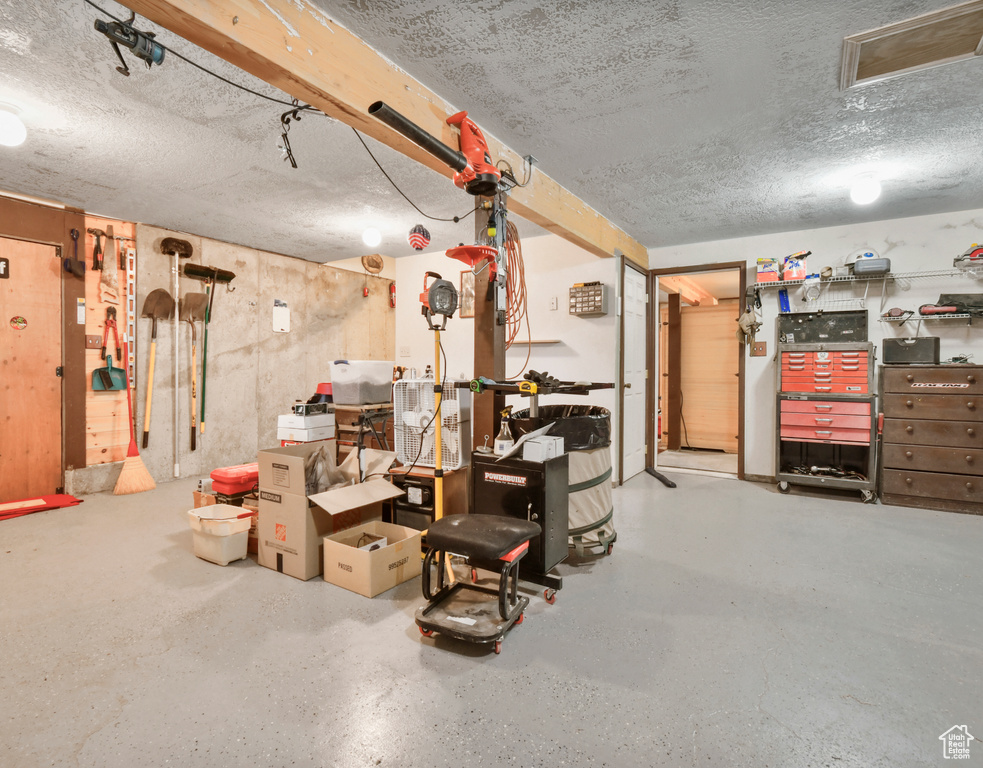 Below grade area featuring a textured ceiling