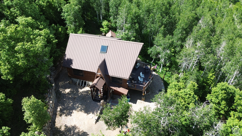 View from above of property featuring a heavily wooded area