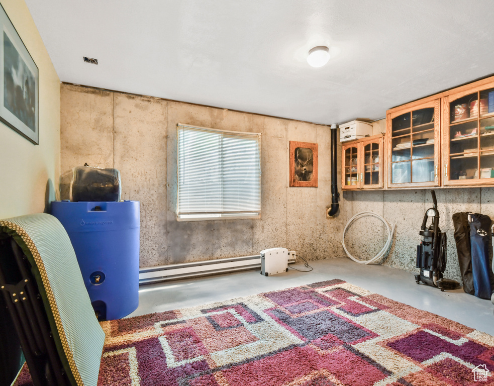 Basement with a baseboard heating unit