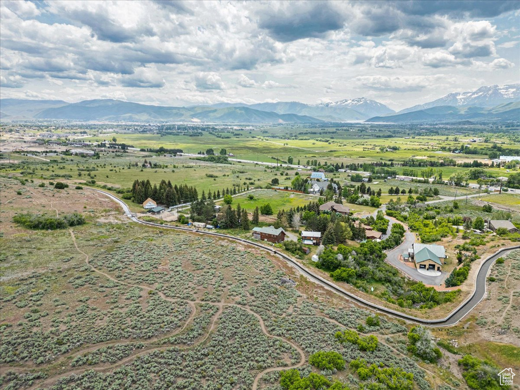 Overview of rural landscape with a mountain backdrop