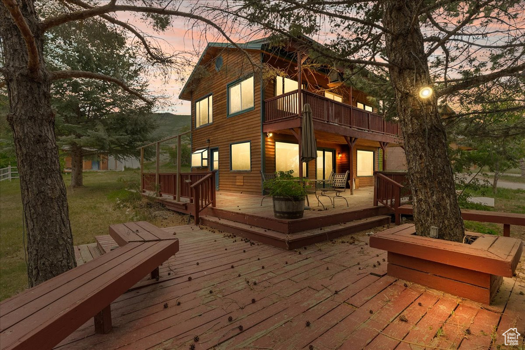 Deck at dusk with a patio area