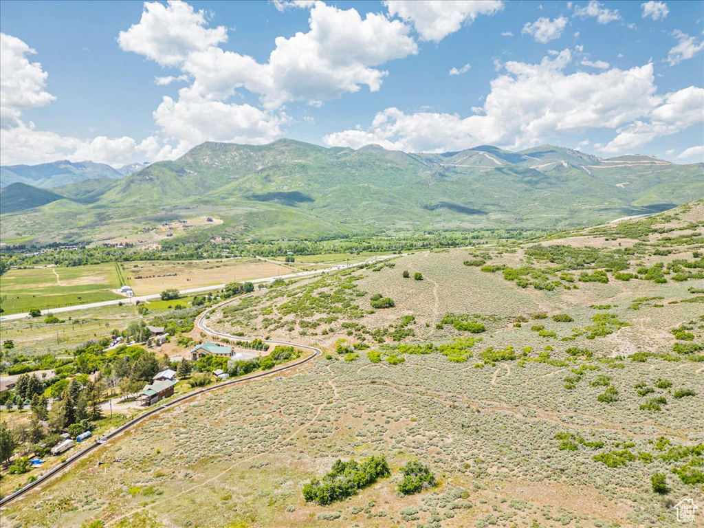 View of mountain backdrop with rural landscape