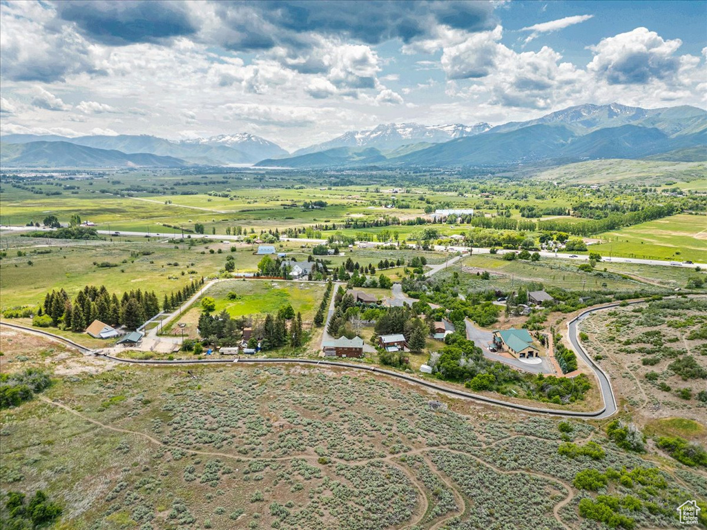 Overview of rural landscape featuring a mountainous background