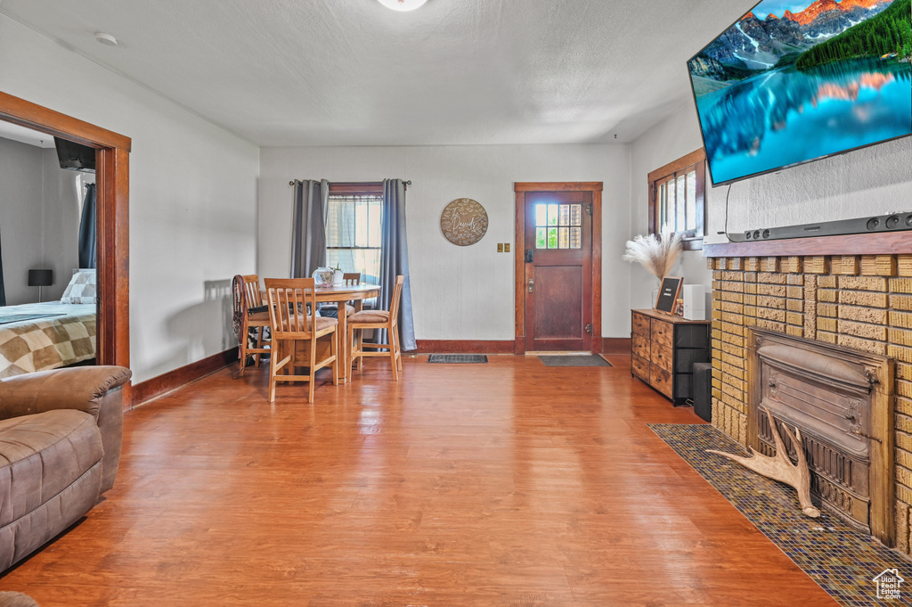 Living room featuring wood finished floors and plenty of natural light