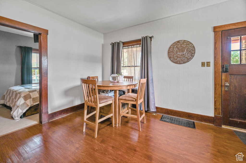 Dining area with wood finished floors and baseboards