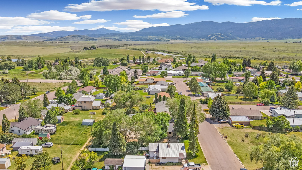 Aerial view of residential area featuring a mountain backdrop