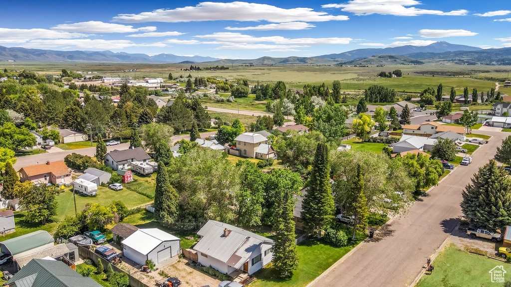 Aerial perspective of suburban area featuring a mountain backdrop