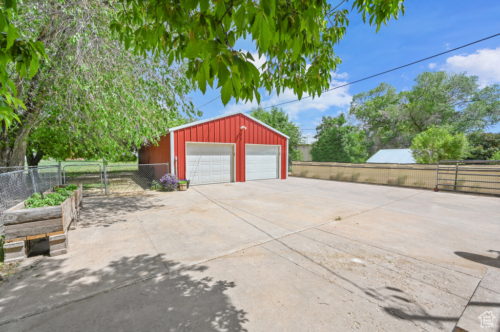 Detached garage featuring a gate