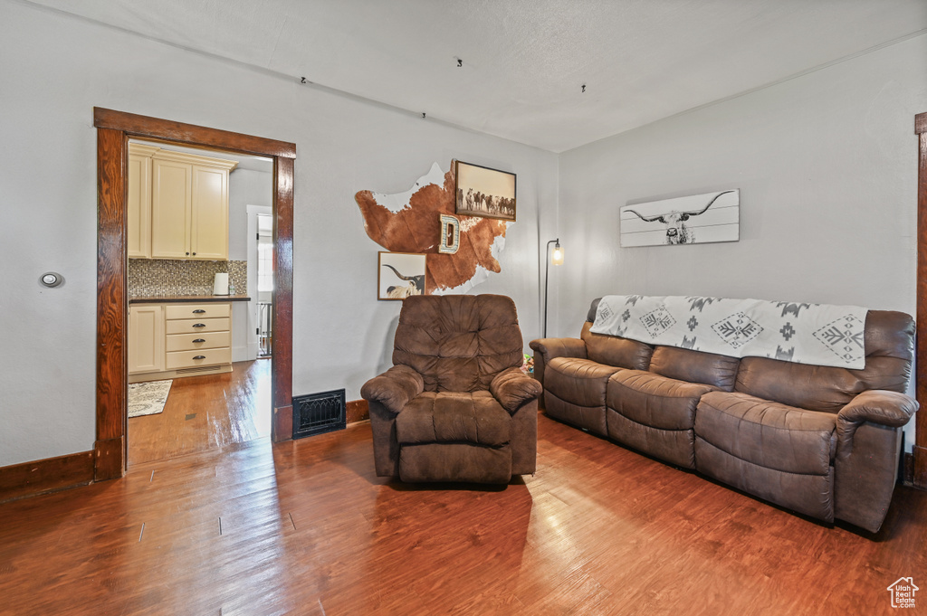 Living room featuring wood finished floors and baseboards