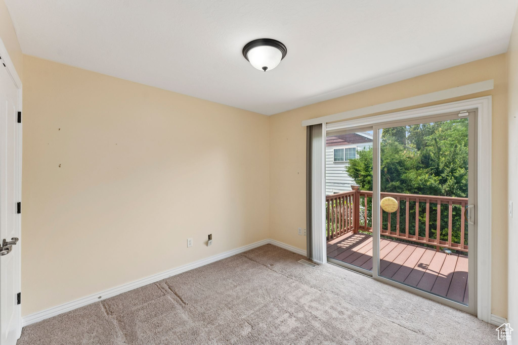 Spare room with carpet floors and baseboards