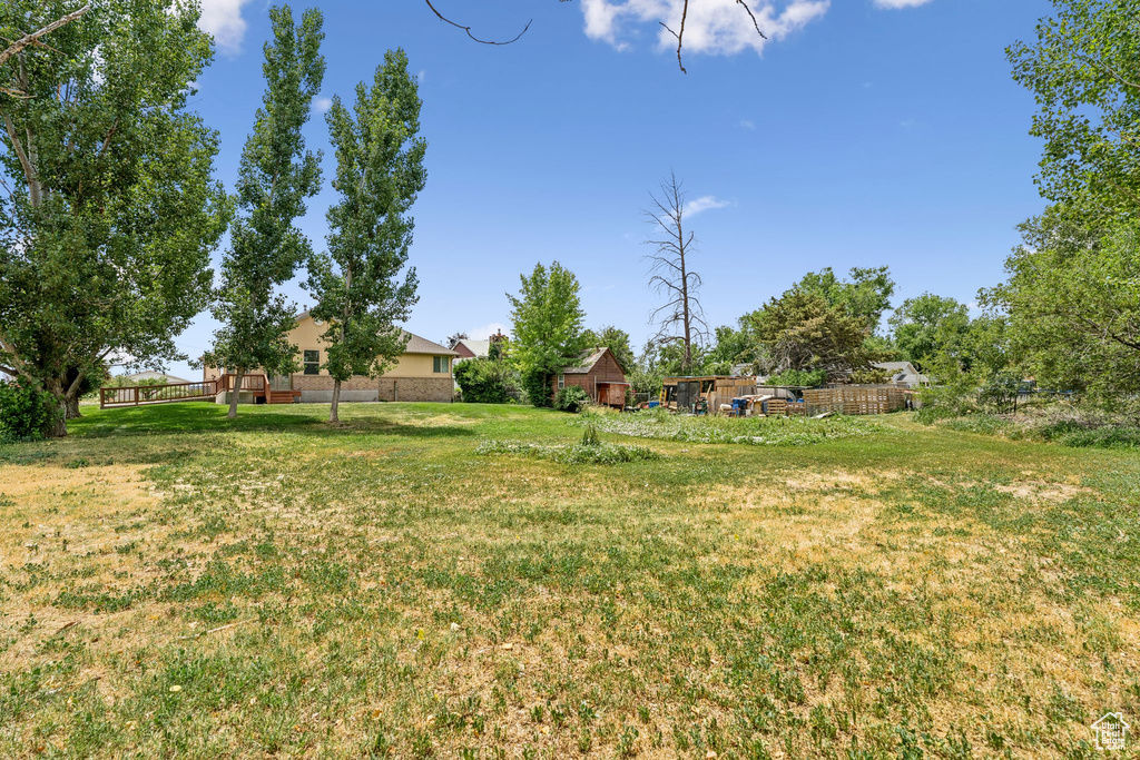 View of yard with a deck
