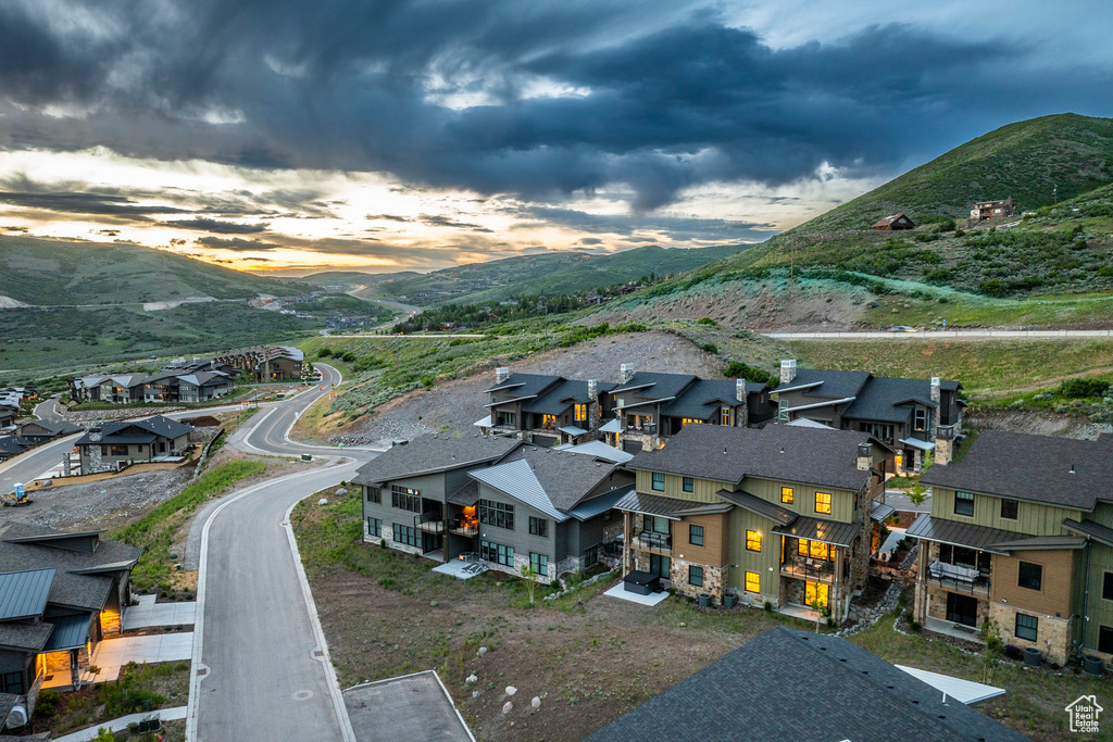 Aerial perspective of suburban area featuring a mountainous background