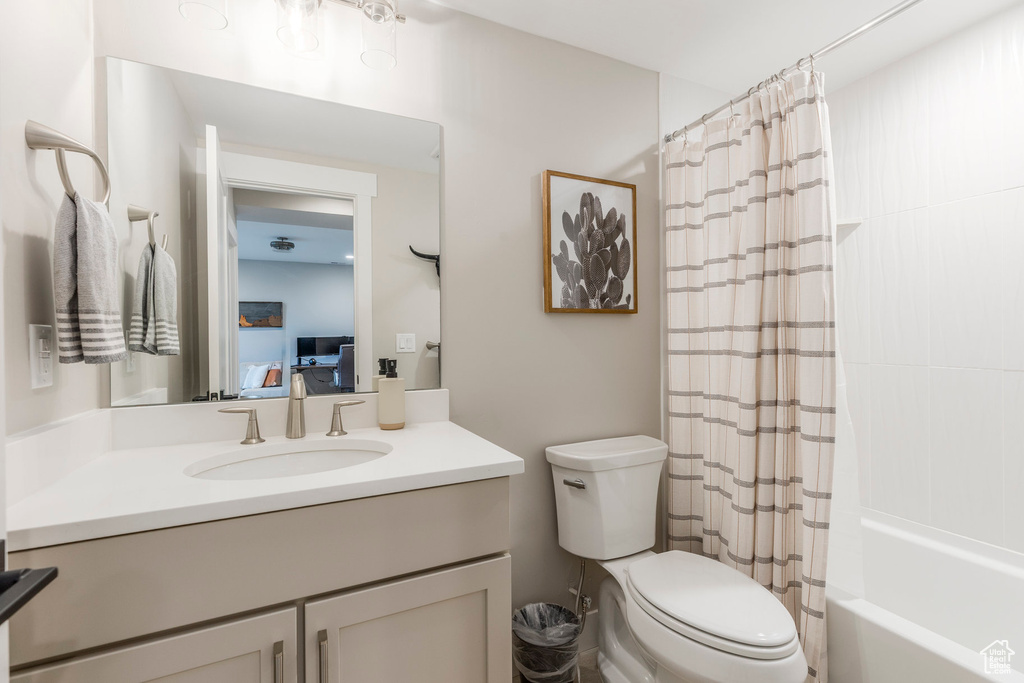 Full bath featuring vanity and shower / tub combo