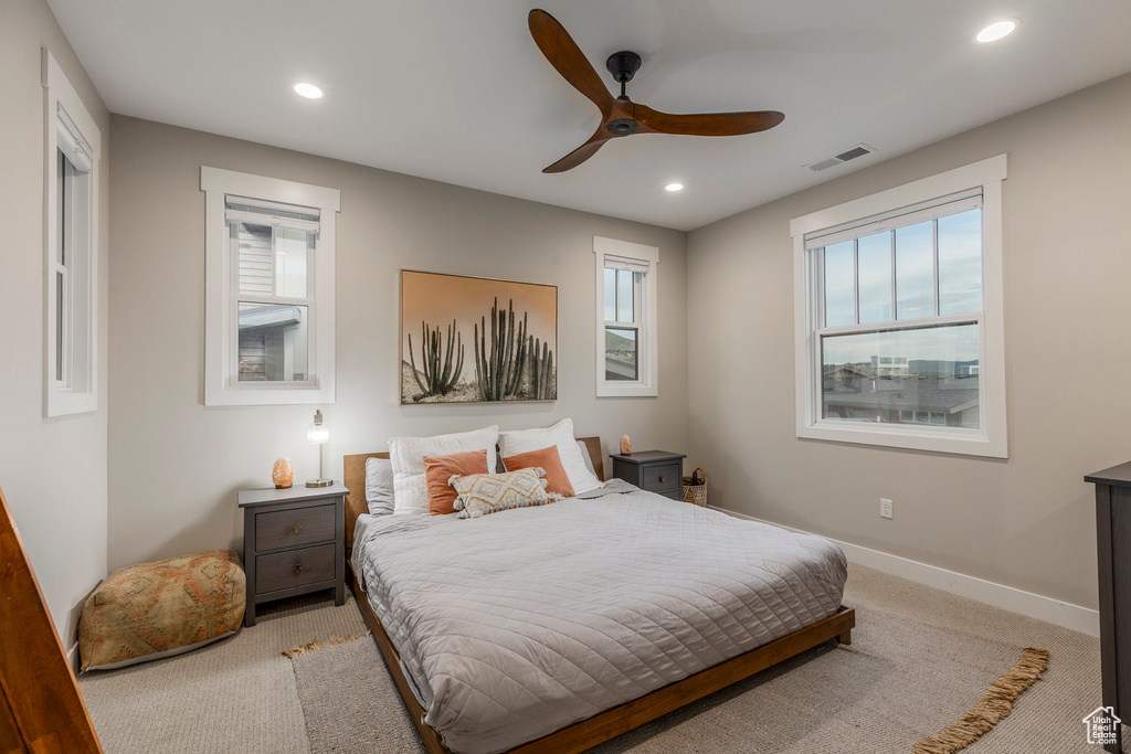 Bedroom featuring recessed lighting, light colored carpet, and a ceiling fan