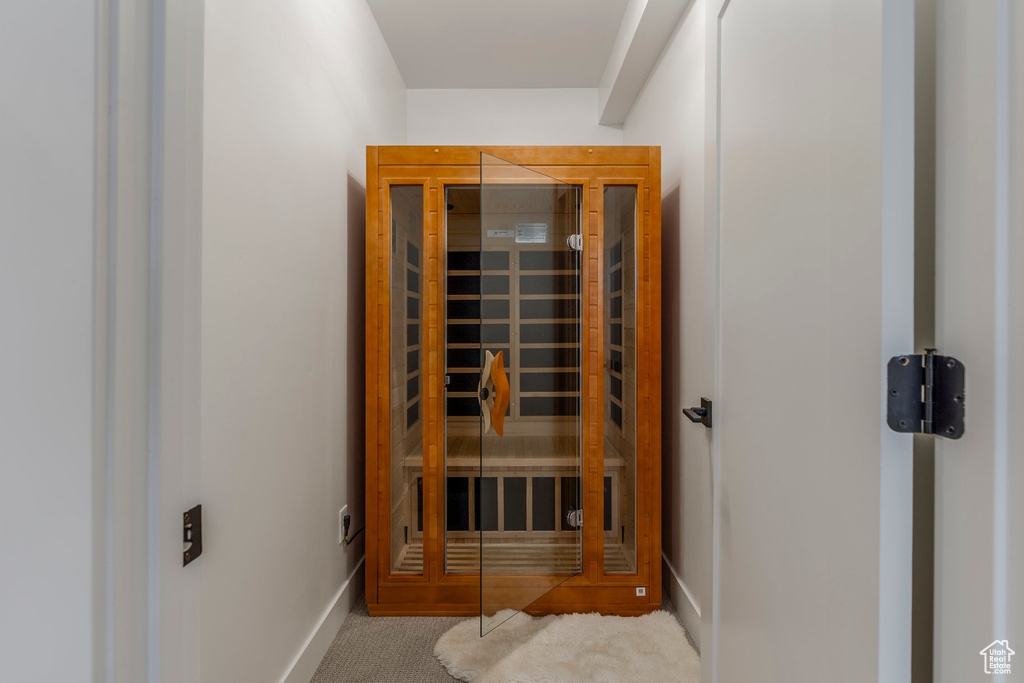 Relaxing sauna with carpet floors and baseboards