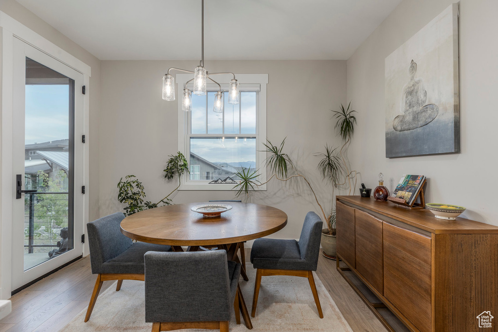 Dining space with light wood-style floors
