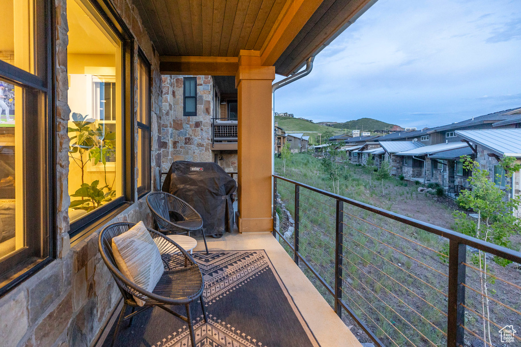 Balcony with a grill and a residential view