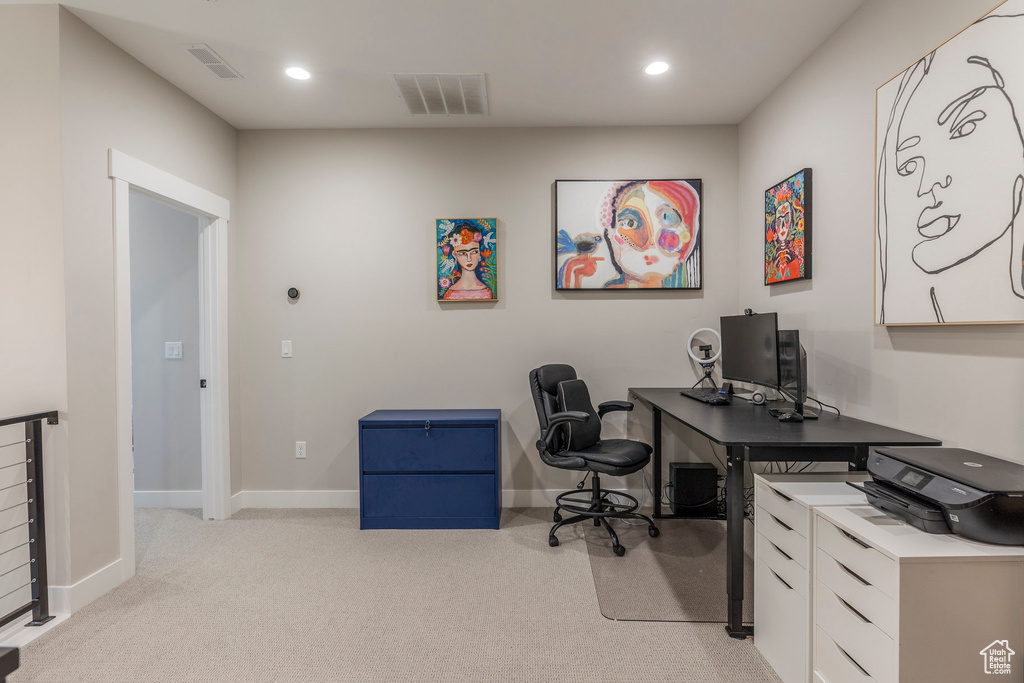 Office featuring light colored carpet and recessed lighting