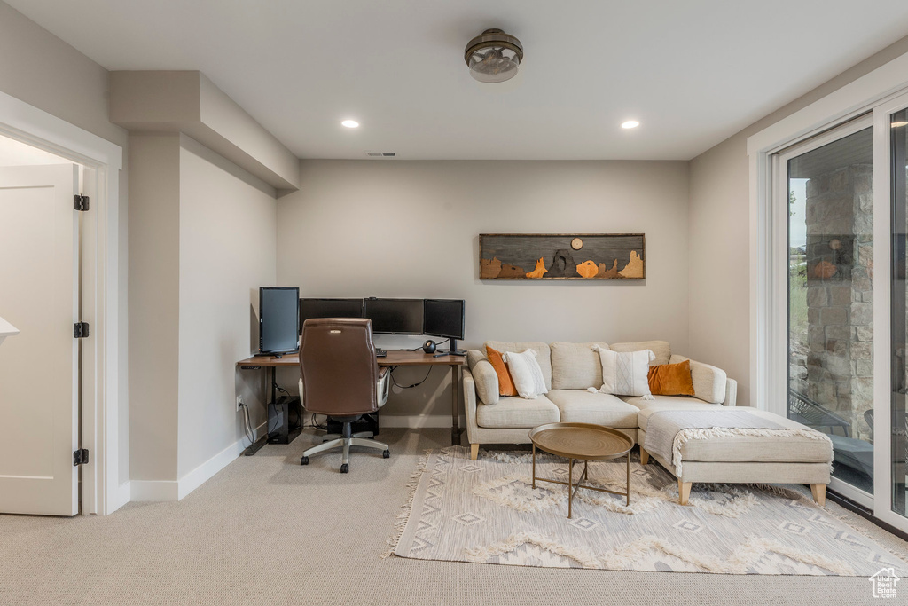 Office area with carpet floors and recessed lighting