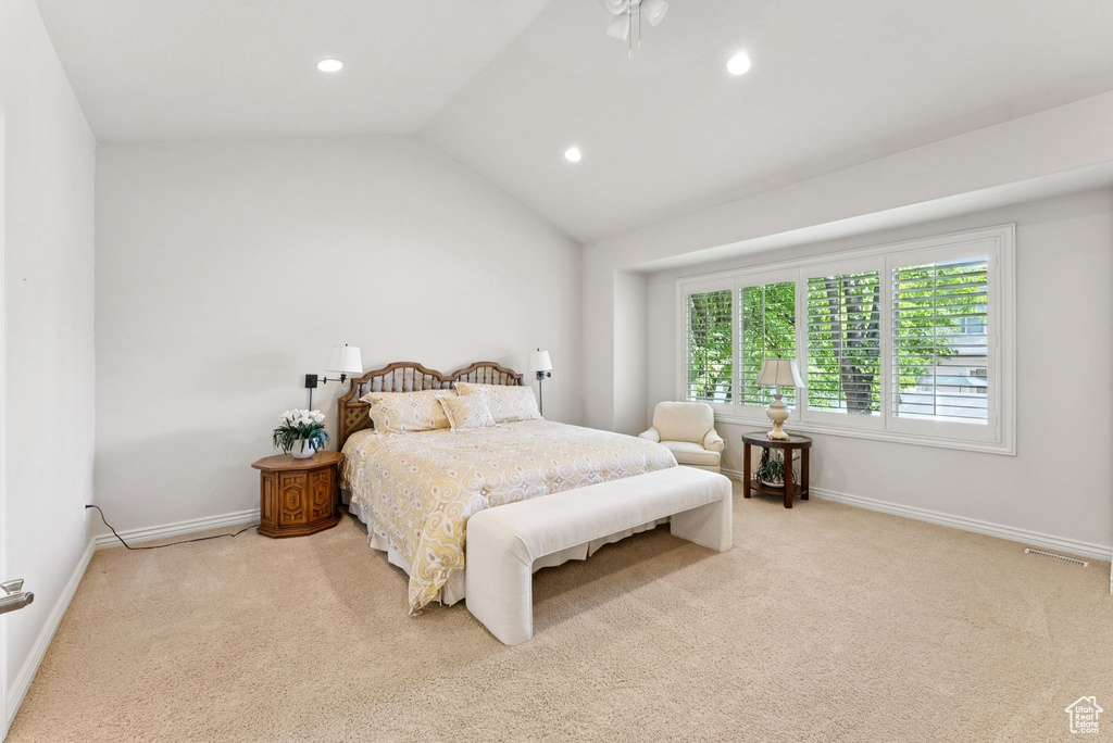 Carpeted bedroom featuring recessed lighting and lofted ceiling