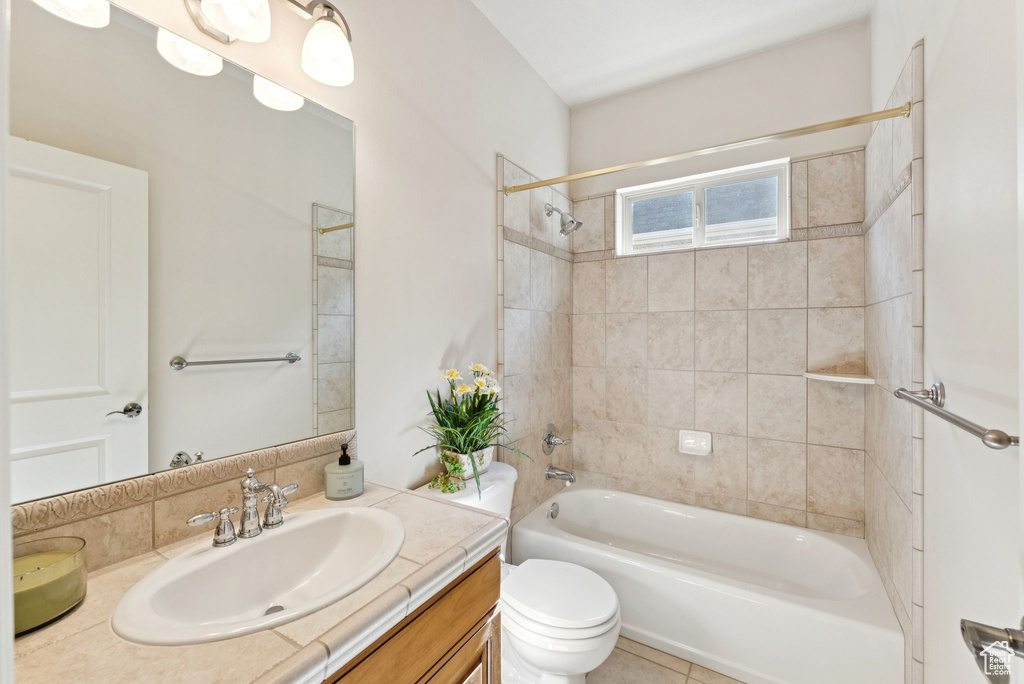 Bathroom featuring vanity and tub / shower combination