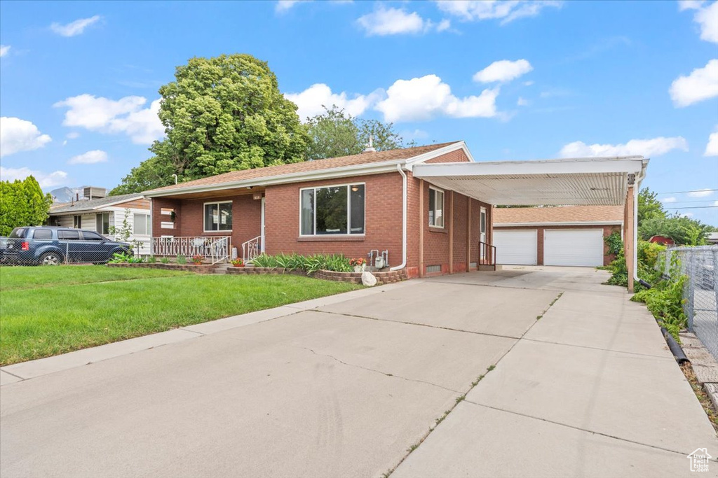 Ranch-style house featuring brick siding, concrete driveway, and covered porch