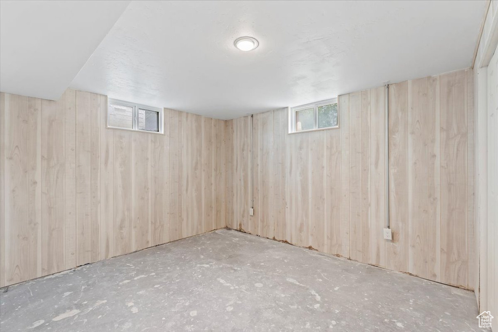 Below grade area featuring wooden walls