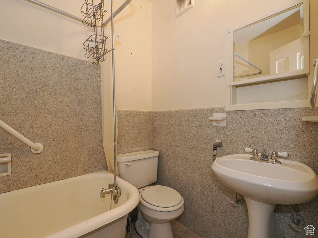Bathroom with toilet and shower / tub combination