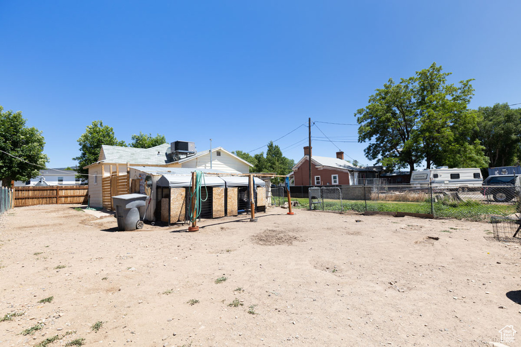 Back of property with exterior structure and an outdoor structure