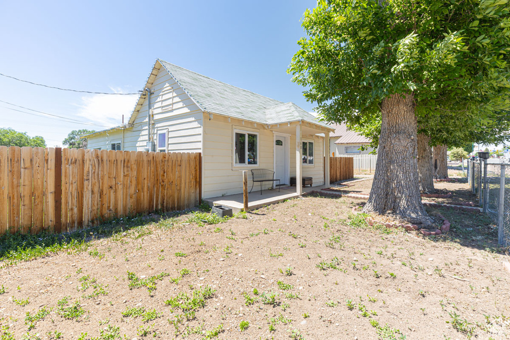 View of front of house with a fenced backyard