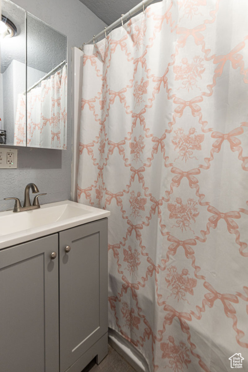 Bathroom with vanity and a shower with curtain