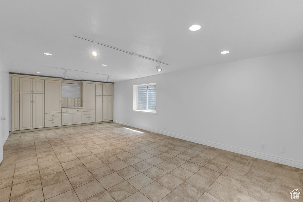 Unfurnished room featuring recessed lighting and rail lighting