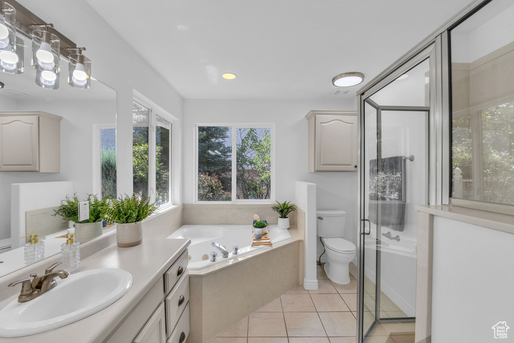 Bathroom with vanity, a bath, tile patterned floors, a shower stall, and recessed lighting