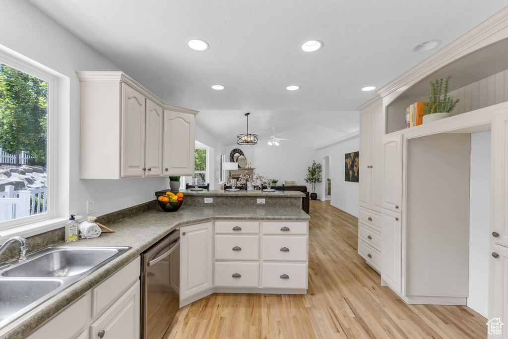 Kitchen featuring stainless steel dishwasher, light wood-style flooring, plenty of natural light, a peninsula, and recessed lighting