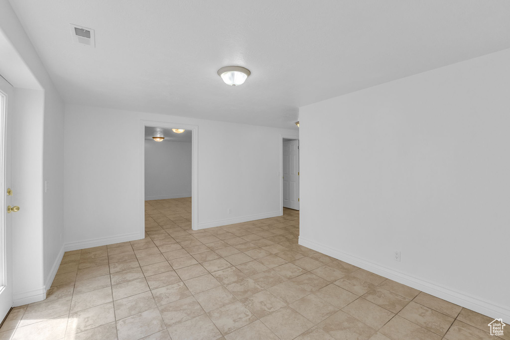 Unfurnished room with baseboards