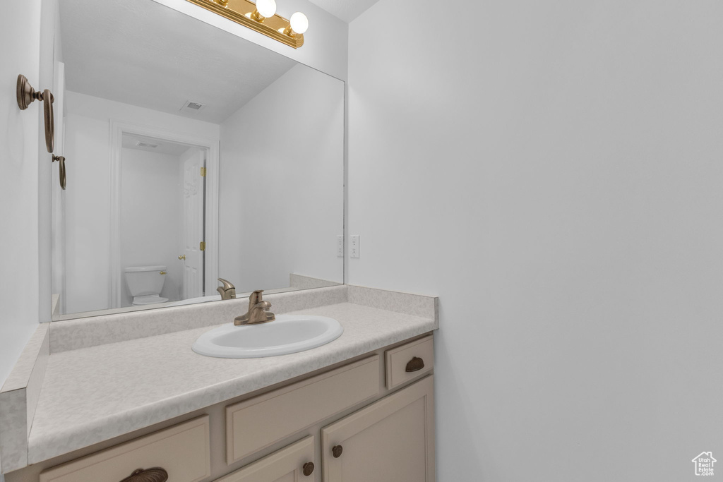 Bathroom with vanity and toilet