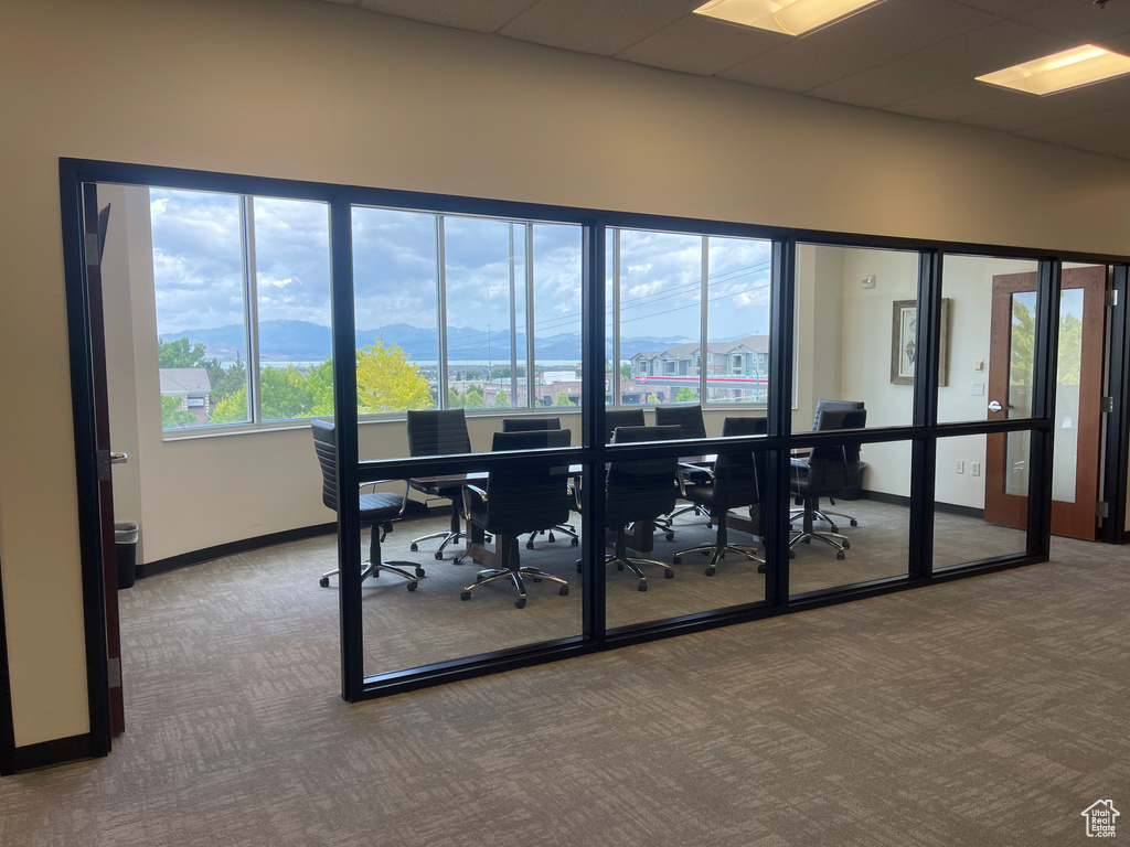 Office space featuring carpet and a mountain view