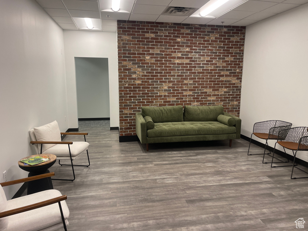 Common area with a paneled ceiling