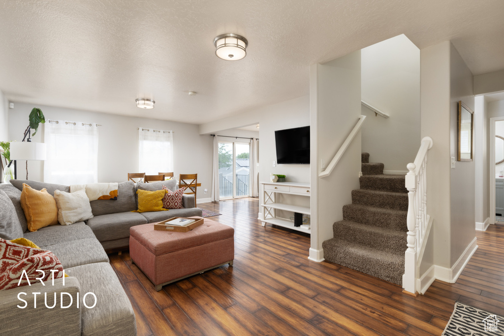 Living area featuring wood finished floors and stairs